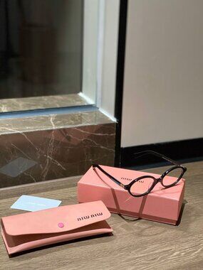 Miu Miu Black Oval Women's Optical Glasses with Gold Temple Detail